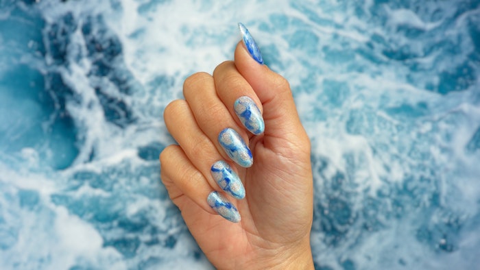 Professional nail artist Miki Higuchi created a marble nail look to show off your big zodiac energy using the brand new OPI Big Zodiac Energy Collection.